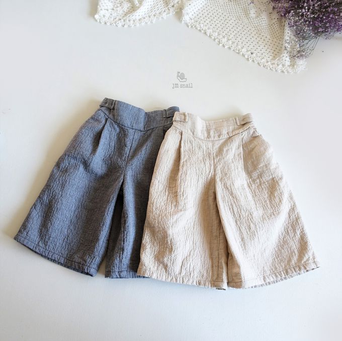 韓國 Jmsnail - 鬆緊腰鈕扣裝飾壓紋長褲-淺卡其