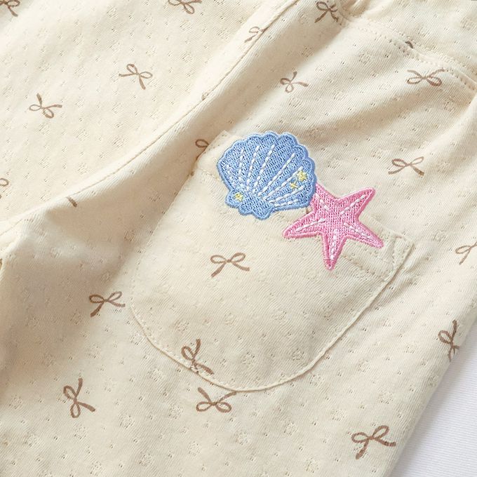 日本 ZOOLAND - 滿版蝴蝶結蕾絲滾邊短褲-貝殼口袋-淺藍