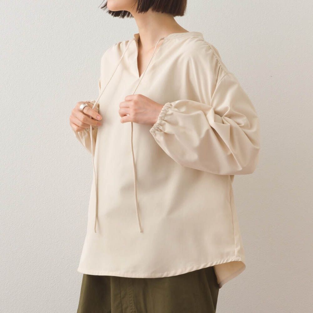 柔滑科技棉 俐落感綁帶澎袖上衣-淺杏