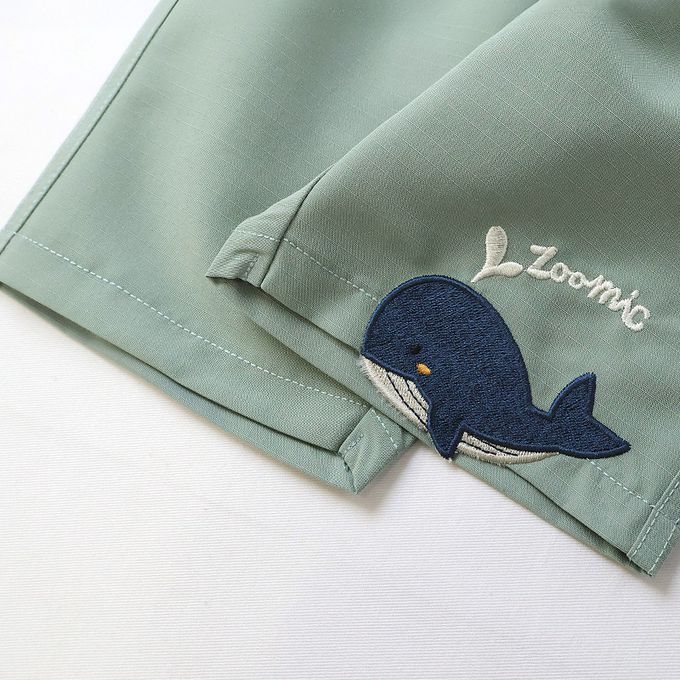 日本 ZOOLAND - 鯨魚悠遊清爽滑面材質短褲-丹寧口袋-摩卡