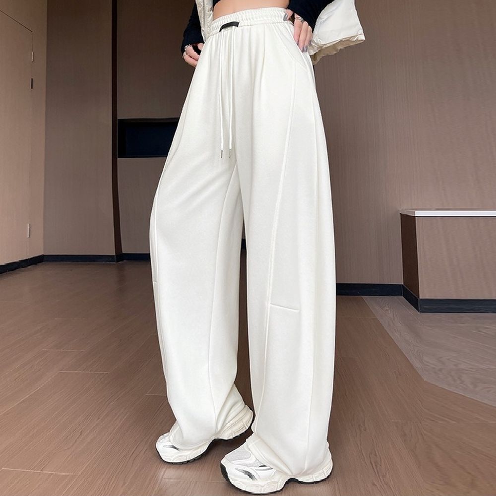 顯瘦修飾胯寬運動休閒彎刀褲-流沙白