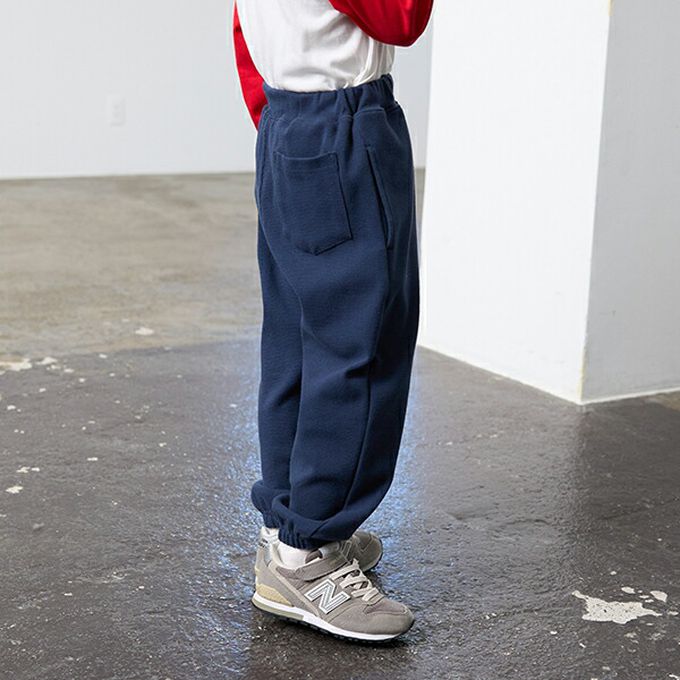 日本 b-ROOM - 彈性休閒素色運動風長褲-海軍藍