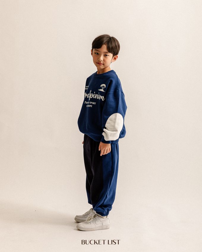 韓國 BUCKET LIST - 鬆緊腰撞色休閒縮口長褲-象牙白X深藍