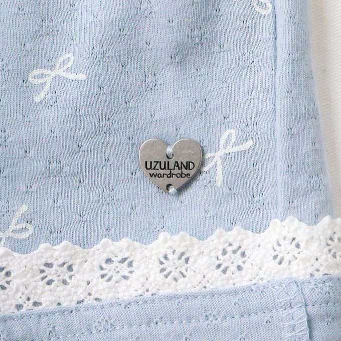 日本 ZOOLAND - 滿版蝴蝶結蕾絲滾邊短褲-貝殼口袋-米杏