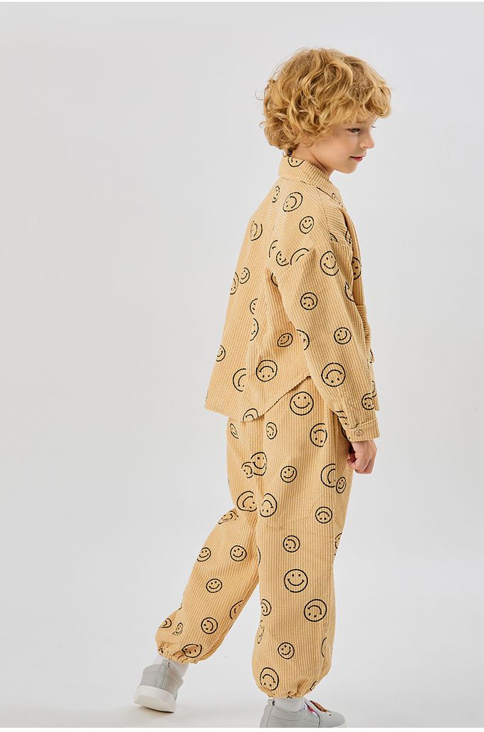 韓國 OZKIZ - 鬆緊腰圓形笑臉印燈芯絨縮口長褲-卡其