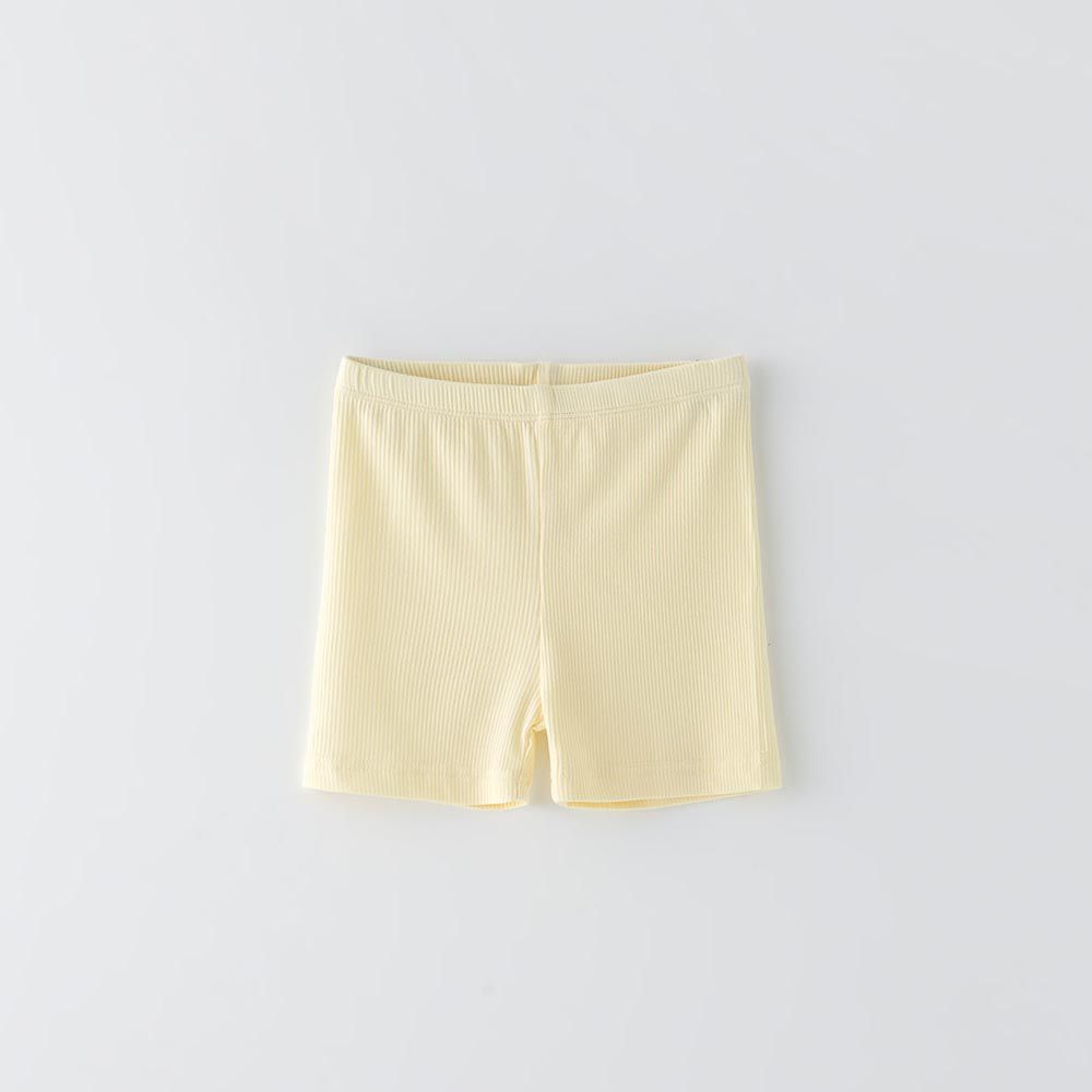 韓國 OZKIZ - 簡約純色彈性內搭短褲-鵝黃
