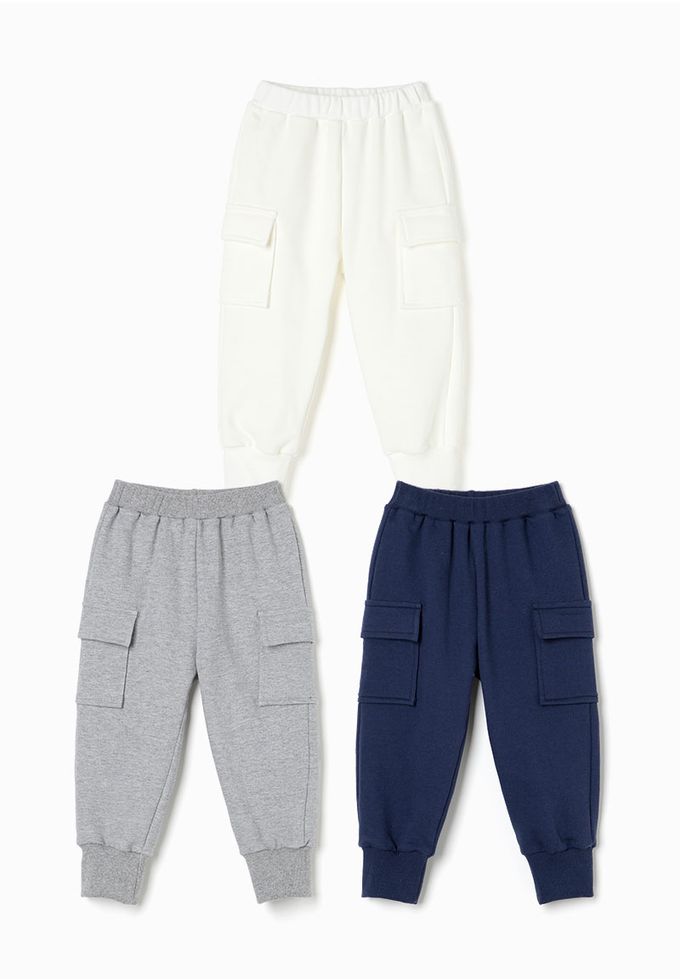 韓國 OZKIZ - 鬆緊腰側邊大口袋縮口長褲-象牙白