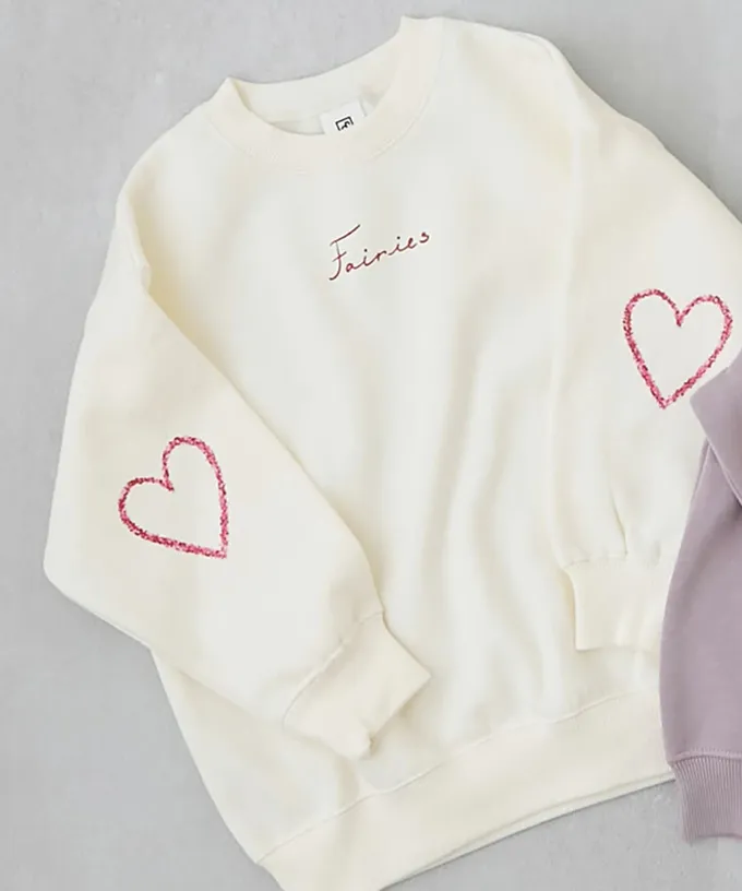 日本 devirock - 熱銷定番 裏起毛女孩印花大學長袖上衣-乳牛愛心-桃粉