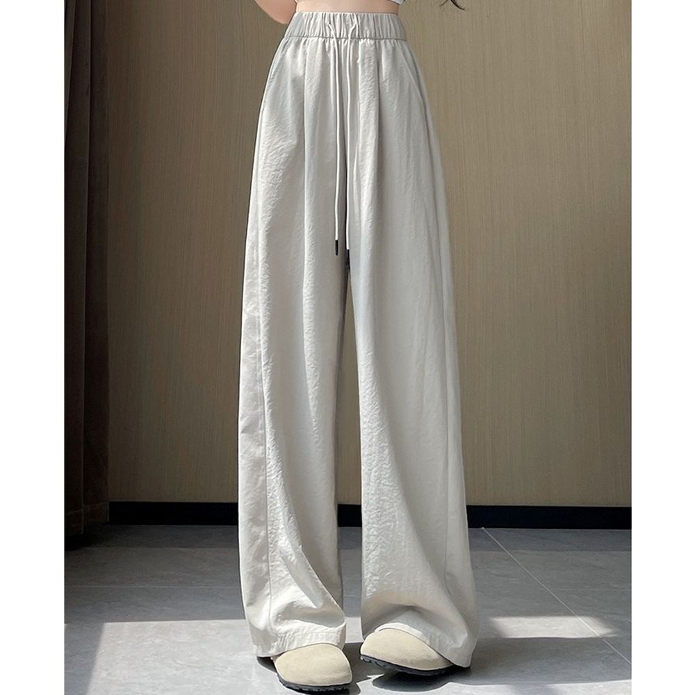 顯瘦修身冰絲休閒彎刀褲-卡其