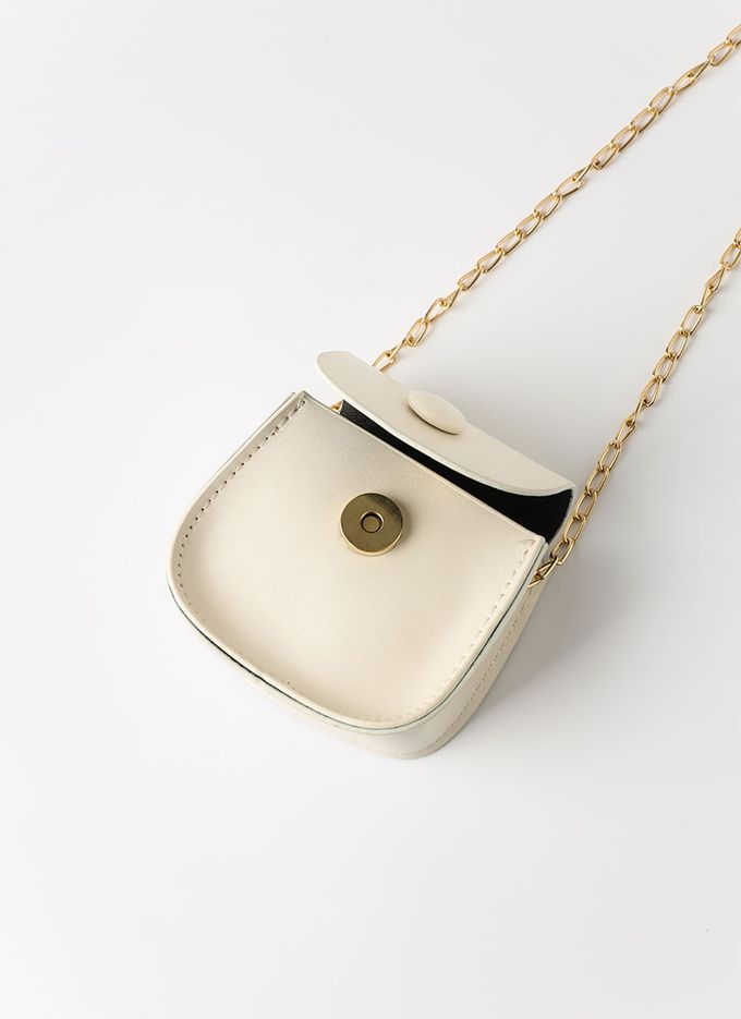 韓國 OZKIZ - (附包包)女孩V字背心百褶裙套裝-象牙白X粉