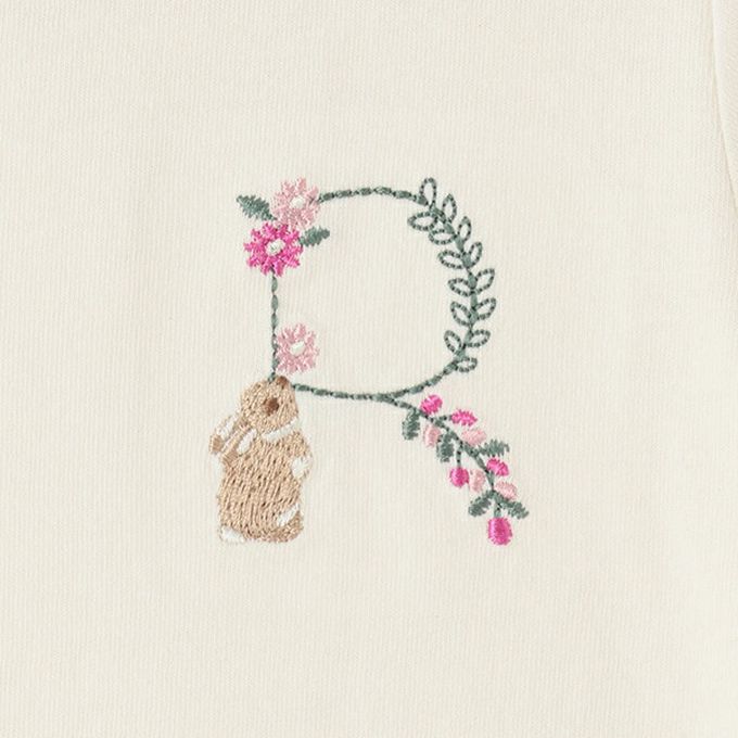 日本 petit main - 荷葉邊英文刺繡短袖上衣-S-鵝黃