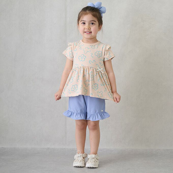 日本 petit main - 荷葉袖傘狀層次短袖上衣-花朵-淡橘