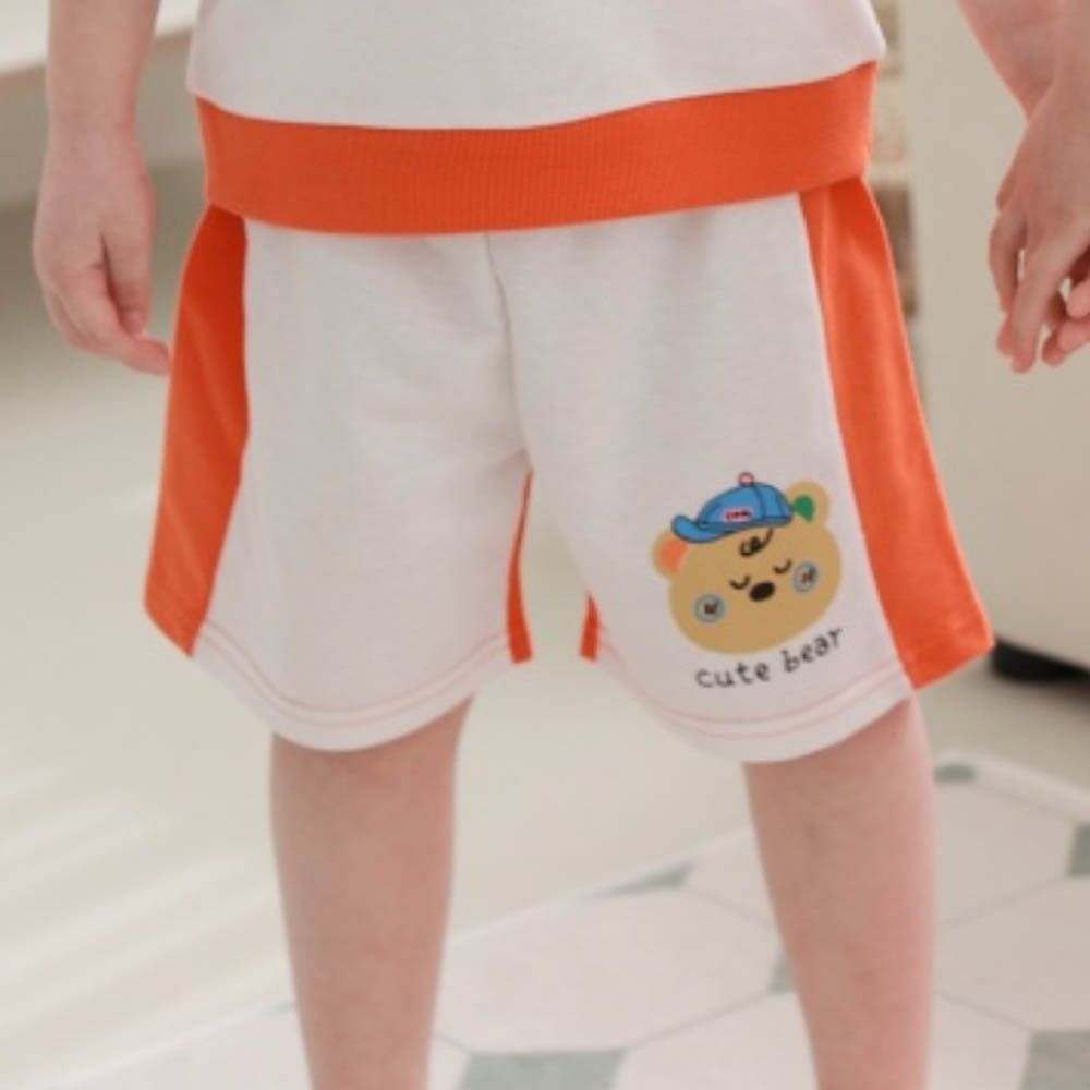 鬆緊腰帽子熊印拼色短褲-橘