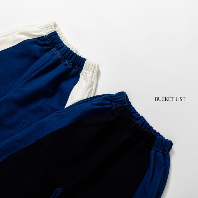 韓國 BUCKET LIST - 鬆緊腰撞色休閒縮口長褲-象牙白X深藍