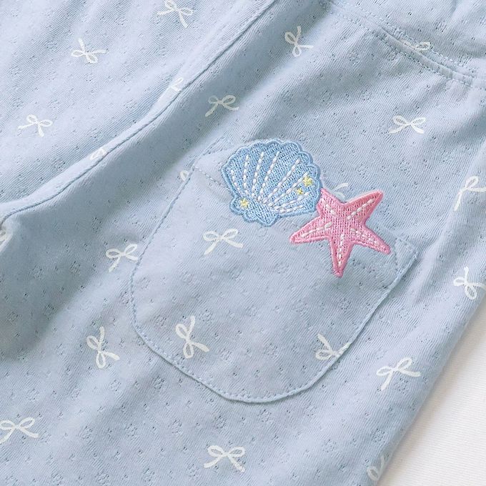 日本 ZOOLAND - 滿版蝴蝶結蕾絲滾邊短褲-貝殼口袋-米杏