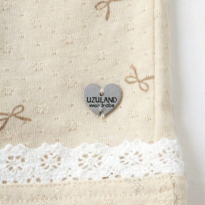 日本 ZOOLAND - 滿版蝴蝶結蕾絲滾邊短褲-貝殼口袋-米杏