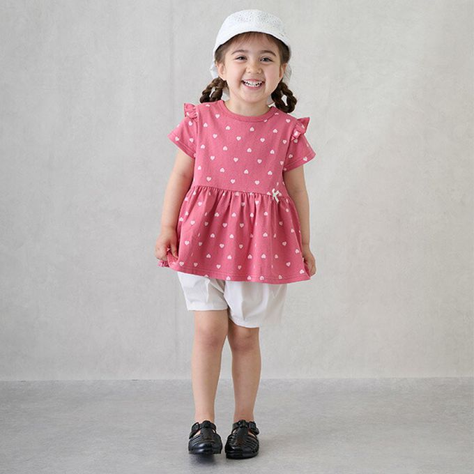 日本 petit main - 荷葉袖傘狀層次短袖上衣-花朵-淡橘