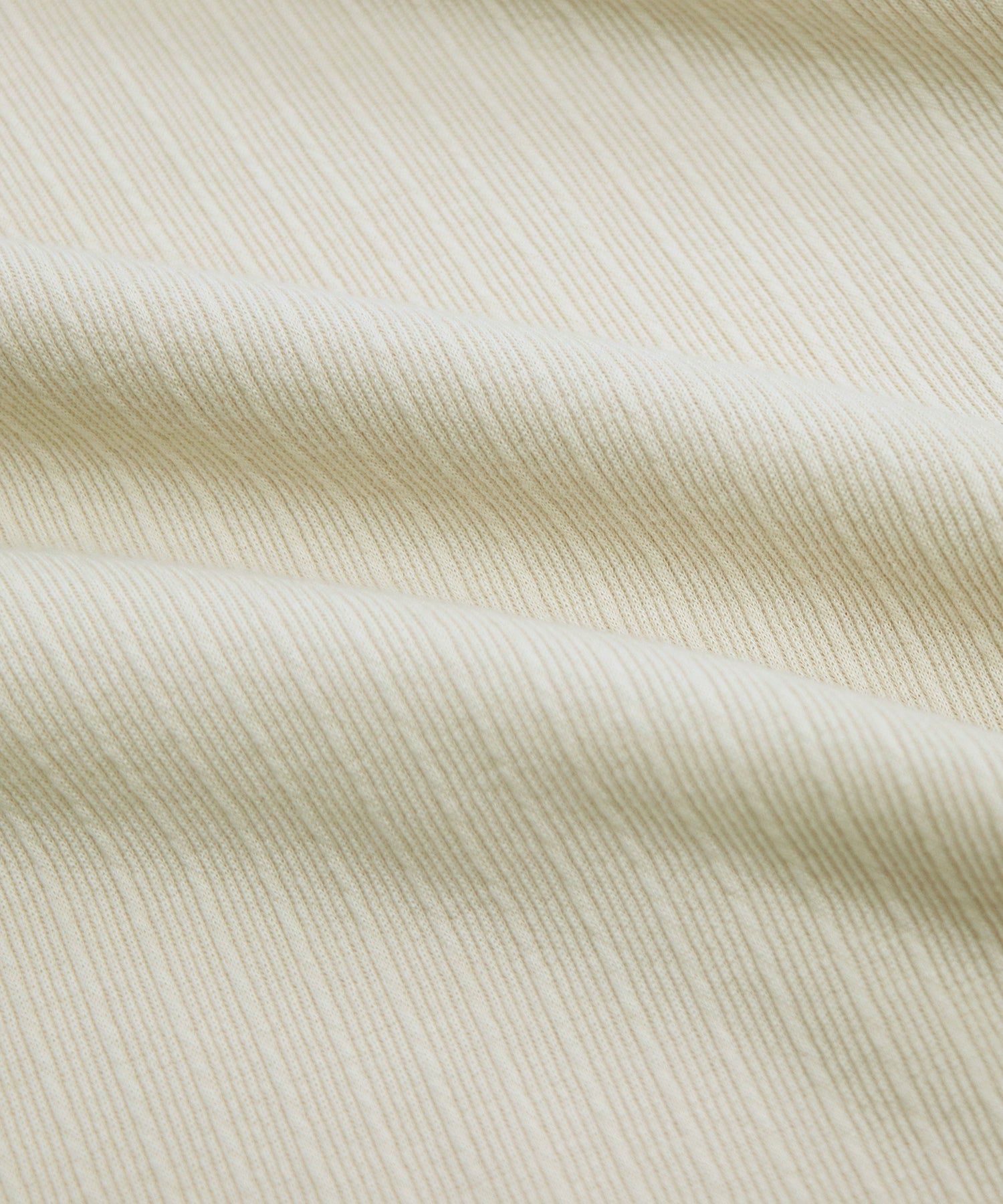 日本 BLUE EAST - 圓領彈性捲邊五分袖上衣-米杏