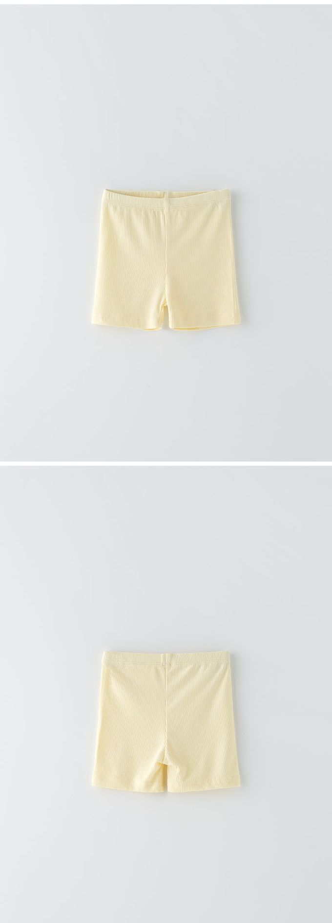 韓國 OZKIZ - 簡約純色彈性內搭短褲-鵝黃