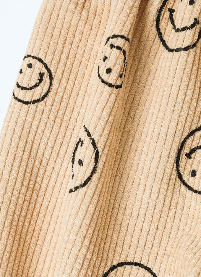 韓國 OZKIZ - 鬆緊腰圓形笑臉印燈芯絨縮口長褲-卡其