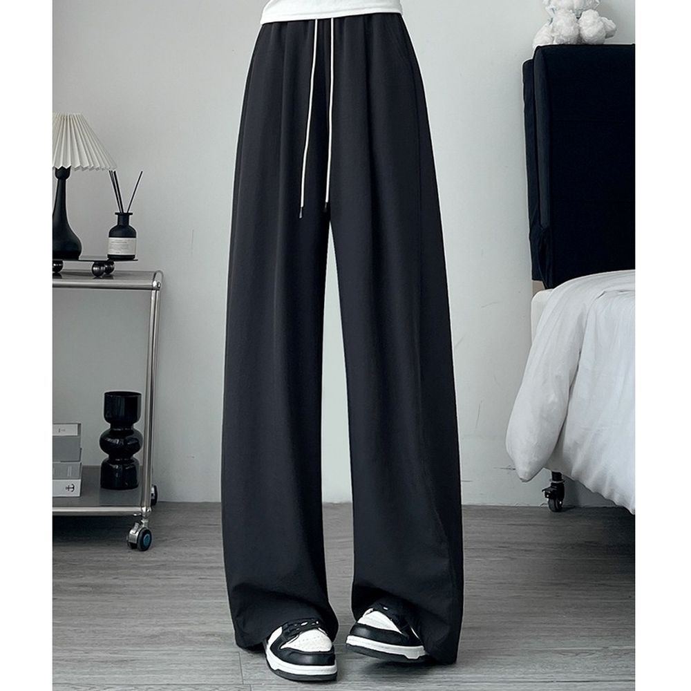 顯瘦修身冰絲休閒彎刀褲-黑