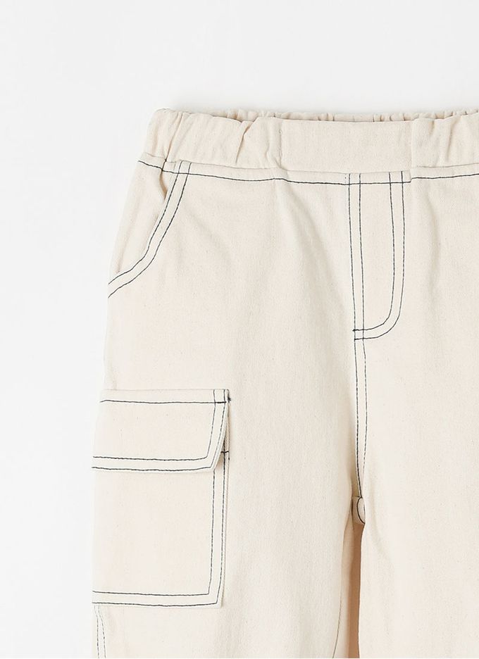 韓國 OZKIZ - 鬆緊腰縫線點綴縮口長褲-象牙白