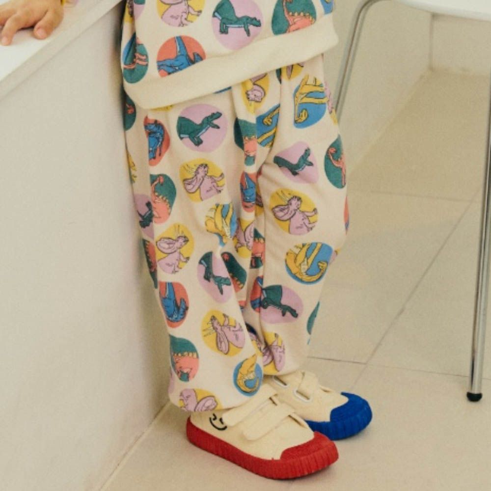 鬆緊腰滿版圓形恐龍縮口長褲-米