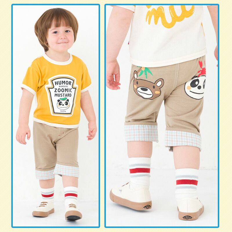 日本 ZOOLAND - 背後童趣印花下擺摺邊短褲-卡其