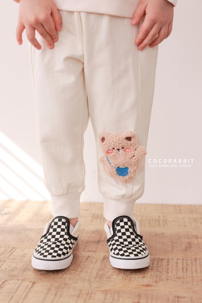 韓國 Coco rabbit - 鬆緊腰立體熊點綴縮口長褲-奶油