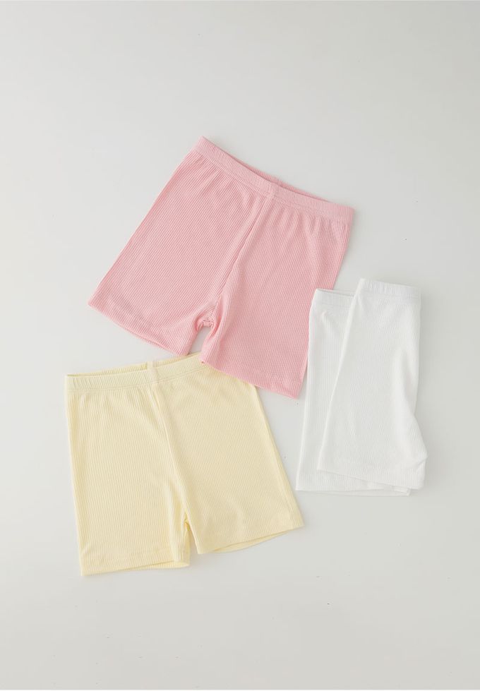 韓國 OZKIZ - 簡約純色彈性內搭短褲-鵝黃