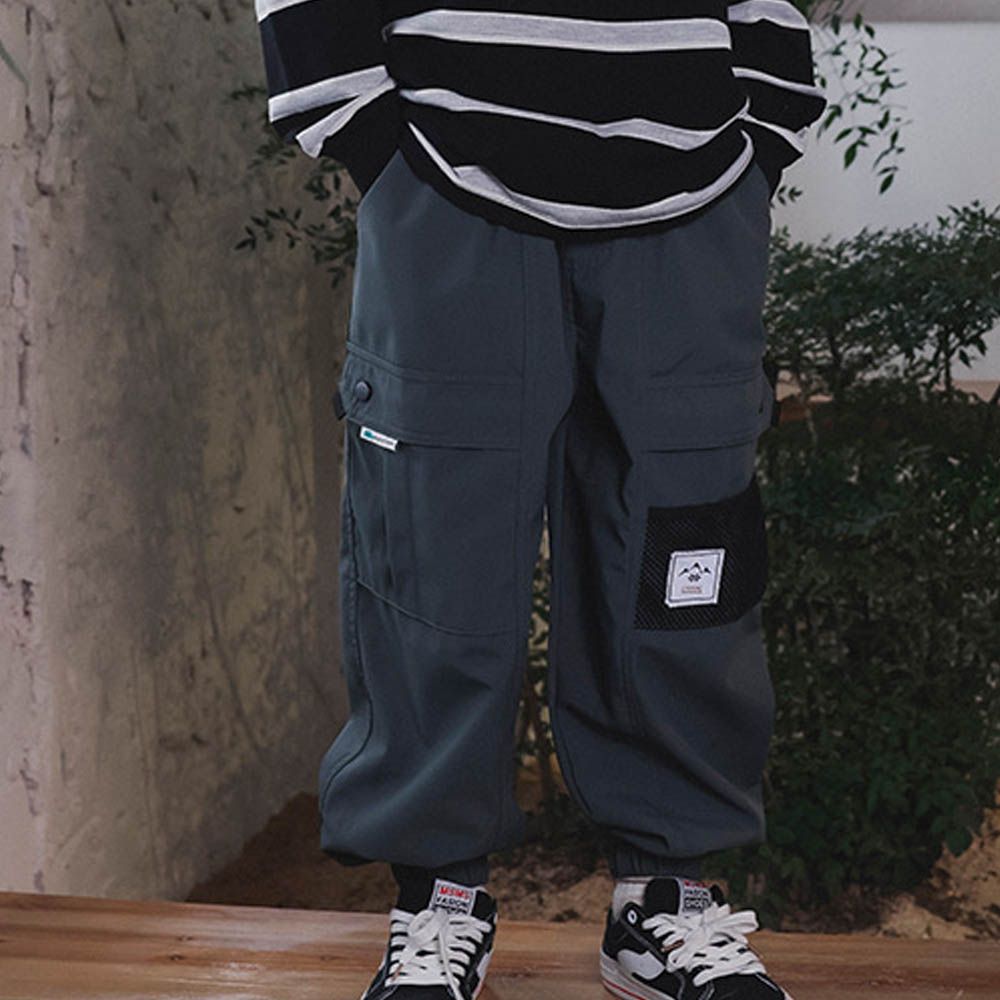 防潑水薄刷絨縮口長褲-個性口袋-藍綠