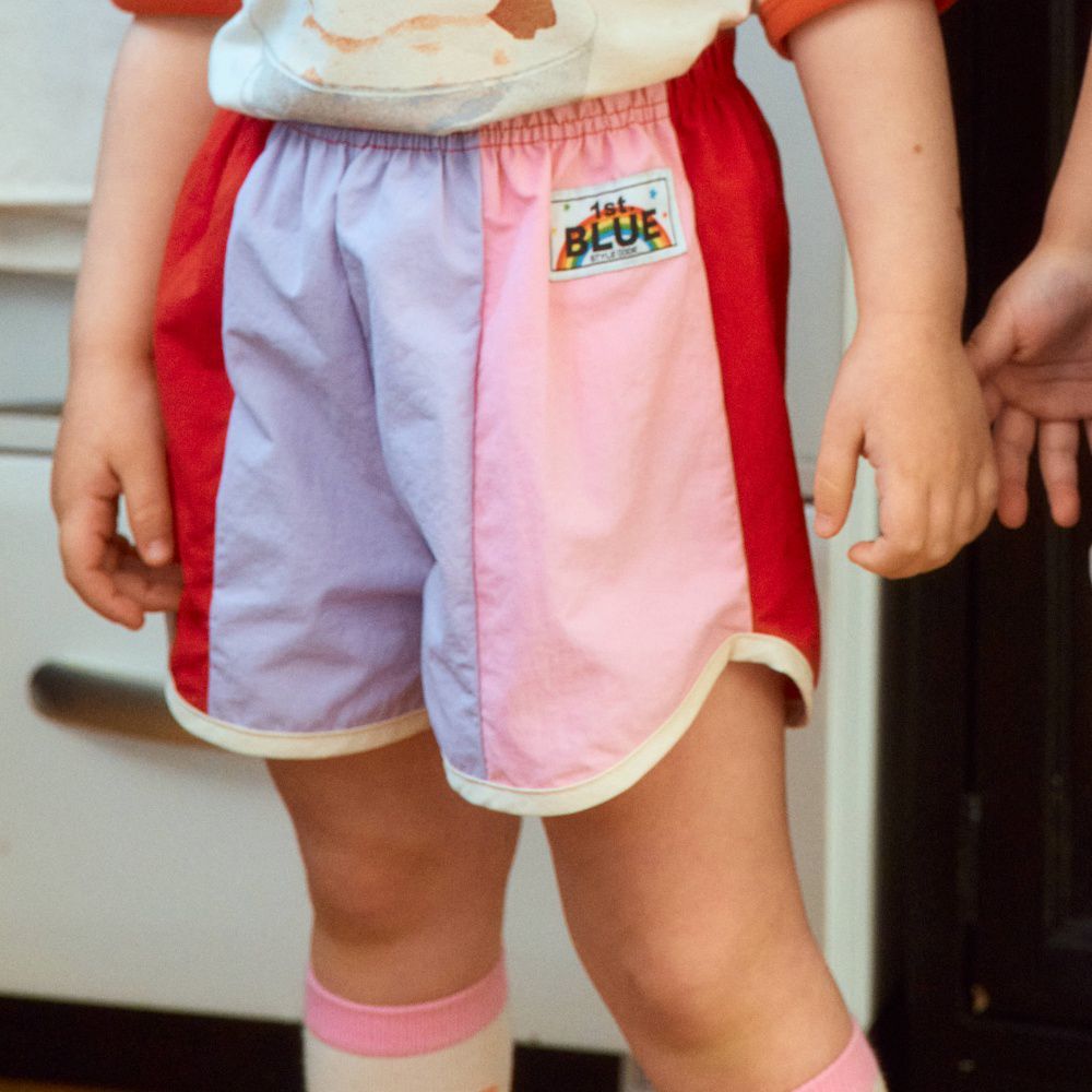 First Blue 鬆緊腰撞色拼接尼龍短褲-淺紫X淺粉X紅