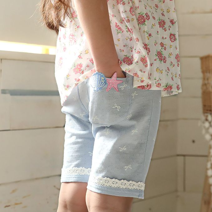 日本 ZOOLAND - 滿版蝴蝶結蕾絲滾邊短褲-貝殼口袋-米杏