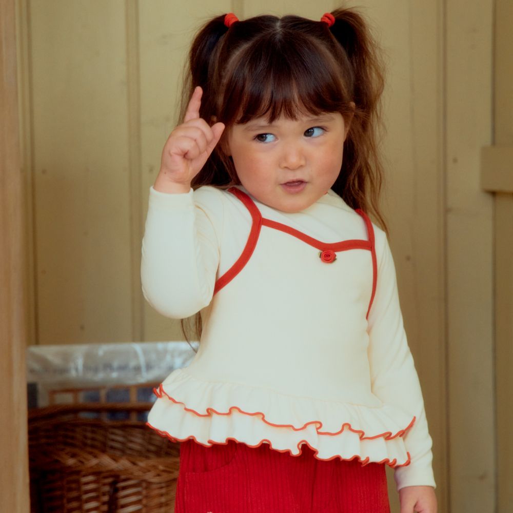 First Blue 假兩件層次荷葉襬彈力長袖上衣-米白