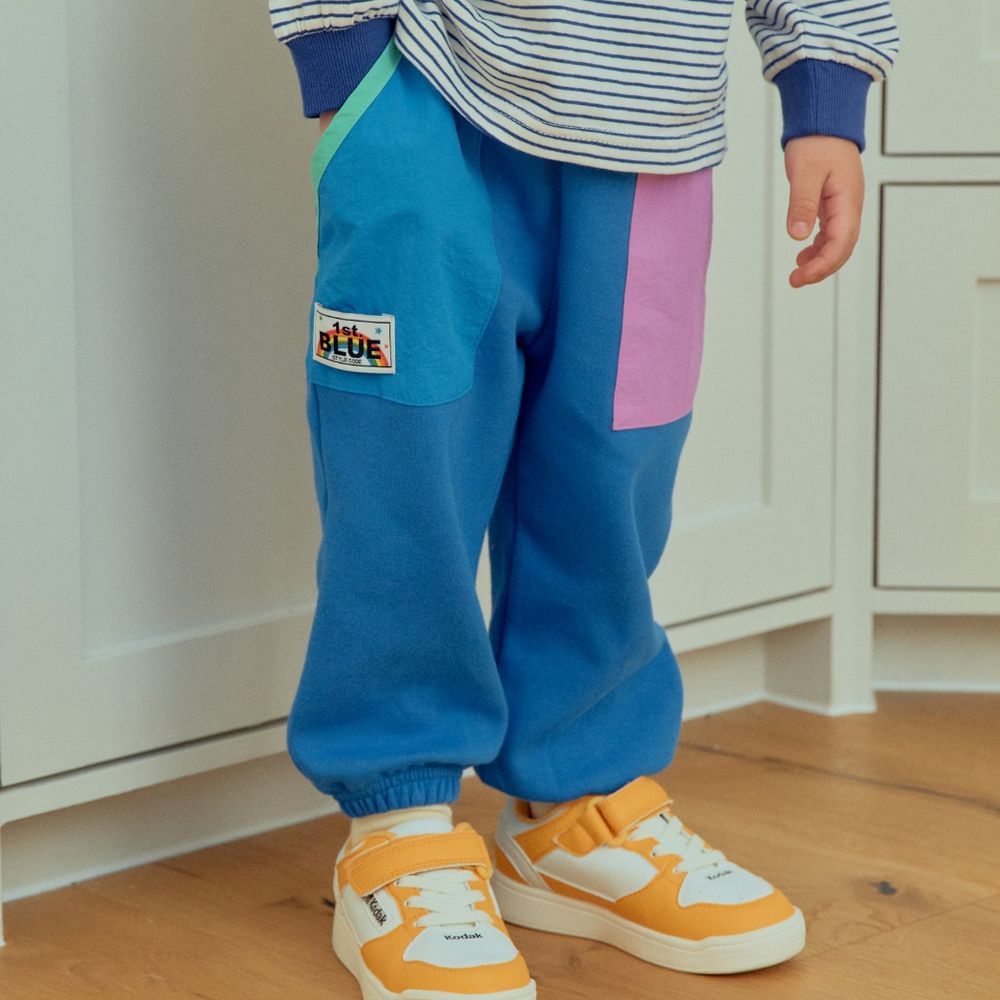 First Blue 鬆緊腰繽紛拼色縮口長褲-藍