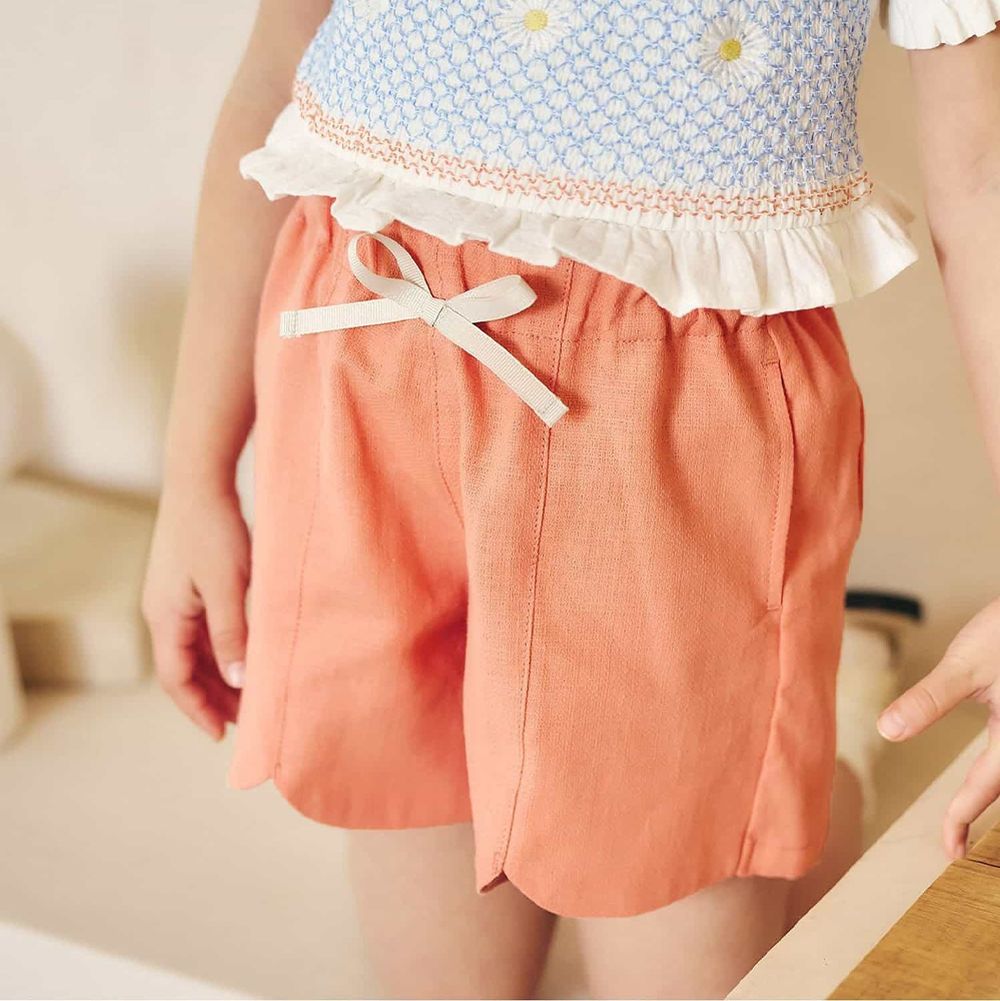 下擺扇形愛心口袋俏麗短褲-素面-橘