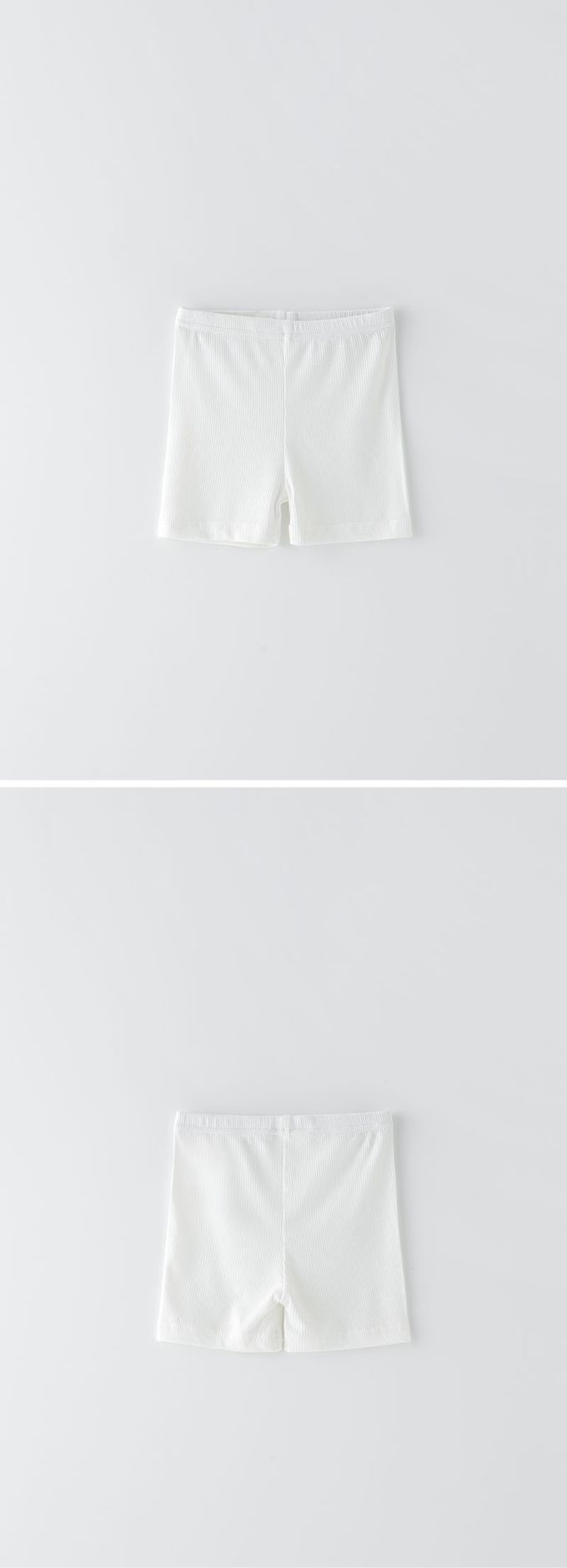 韓國 OZKIZ - 簡約純色彈性內搭短褲-鵝黃