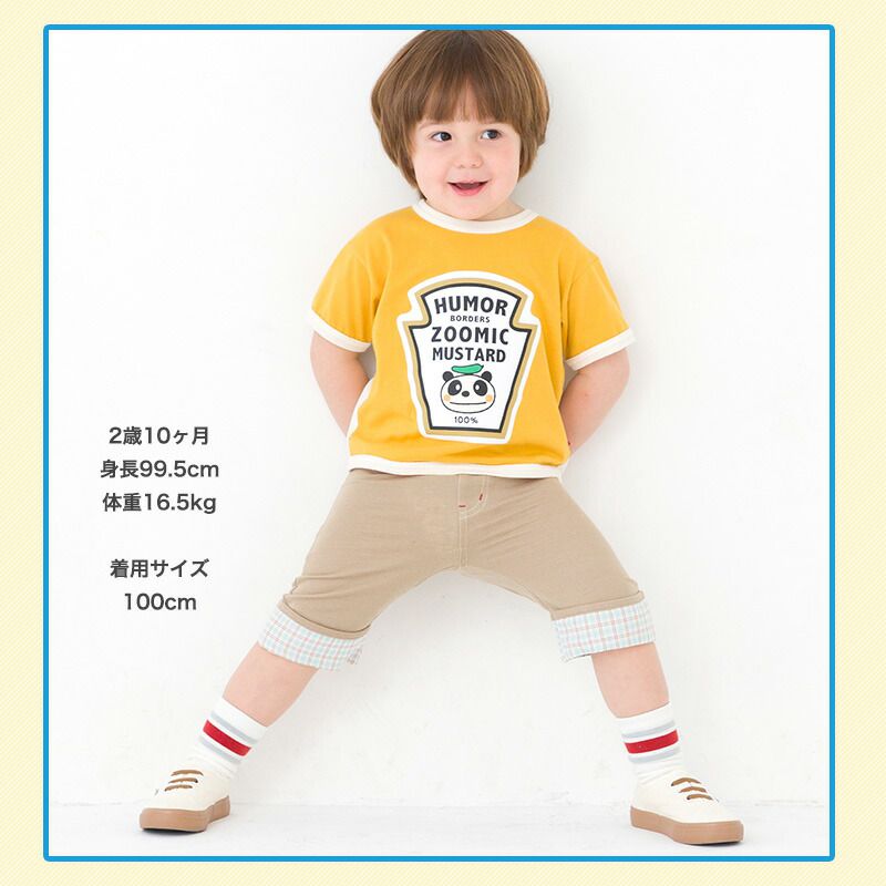 日本 ZOOLAND - 背後童趣印花下擺摺邊短褲-卡其