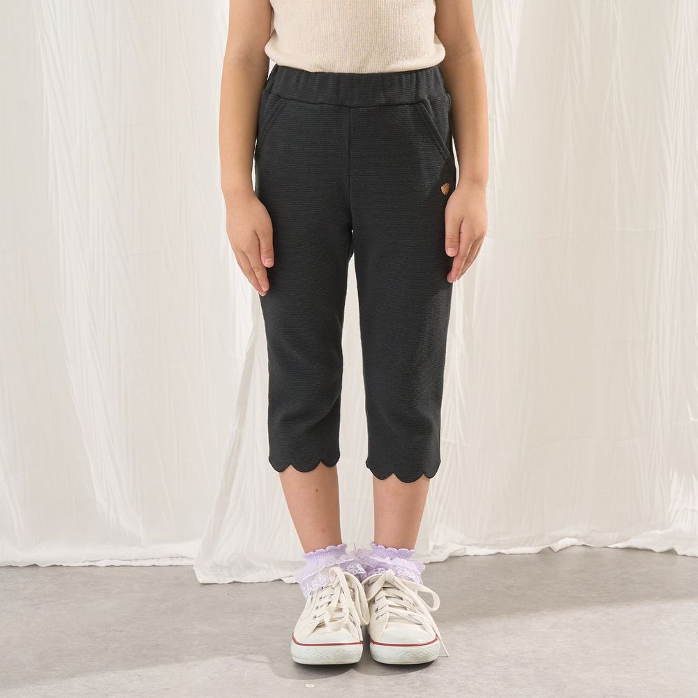 下擺可愛貝殼彈力七分褲-黑