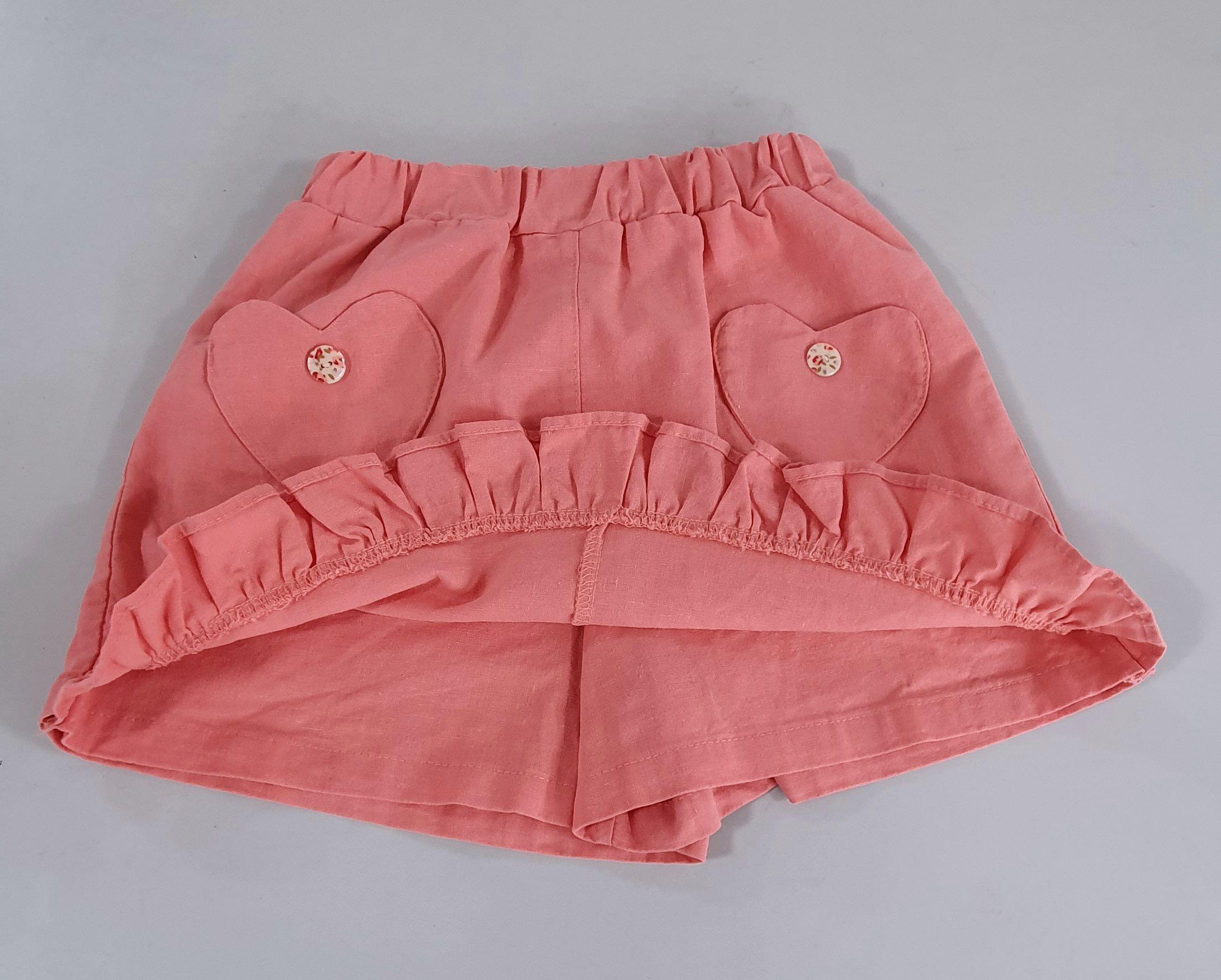 韓國 ERU - 愛心口袋荷葉邊褲裙-珊瑚橘