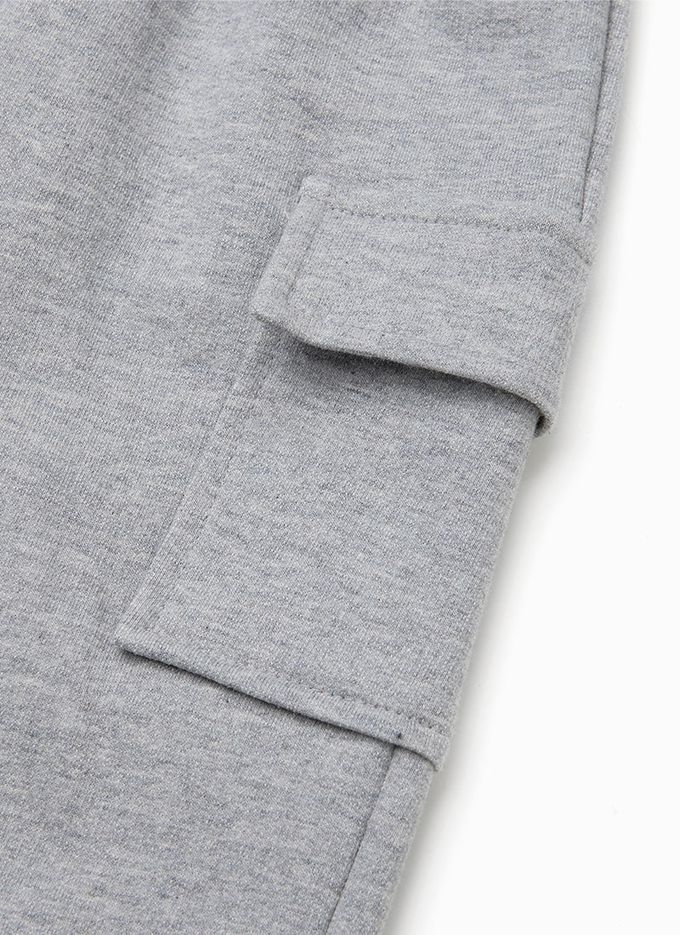 韓國 OZKIZ - 鬆緊腰側邊大口袋縮口長褲-象牙白