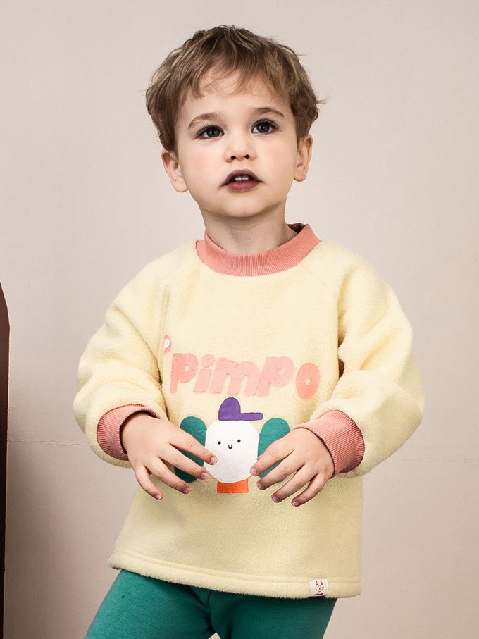 韓國Pimpollo - 圓臉插圖背釦保暖上衣-象牙色