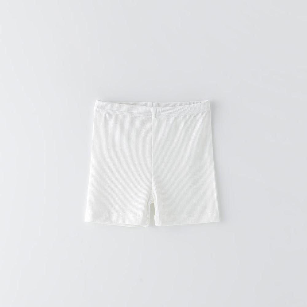 韓國 OZKIZ - 簡約純色彈性內搭短褲-白