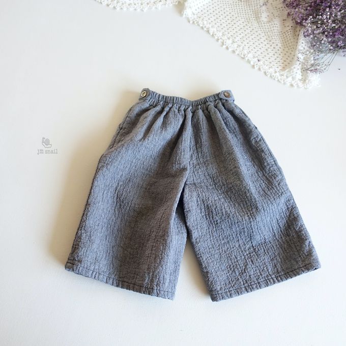 韓國 Jmsnail - 鬆緊腰鈕扣裝飾壓紋長褲-淺卡其