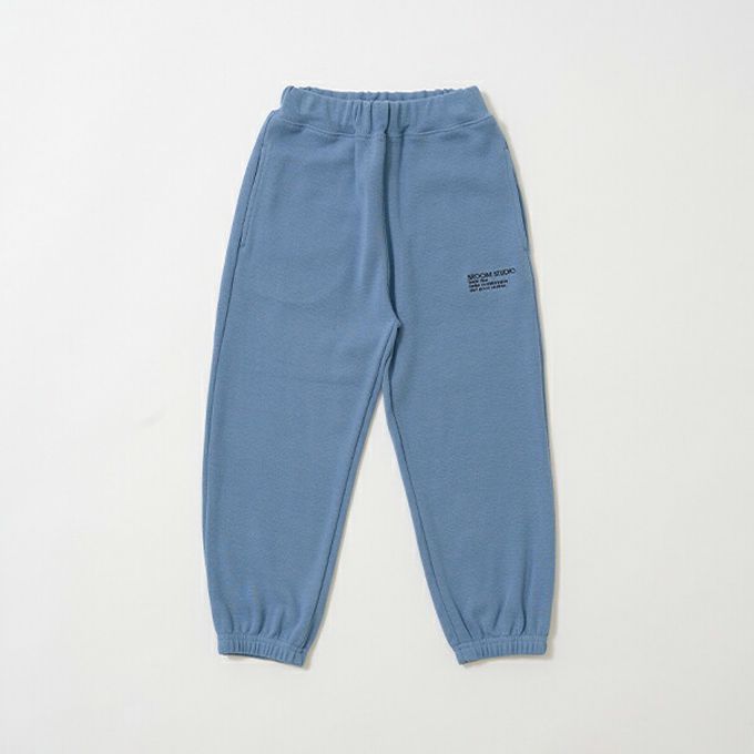 日本 b-ROOM - 彈性休閒素色運動風長褲-米杏